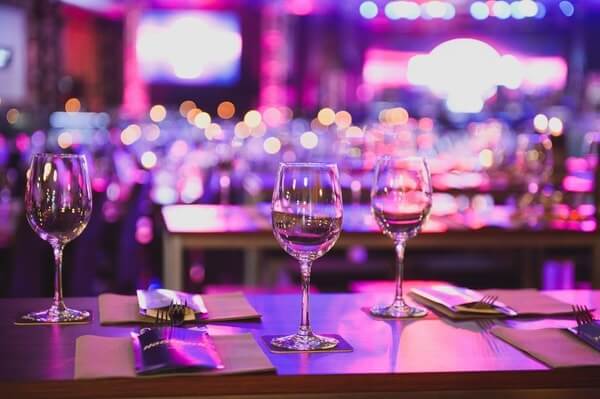 venue lighting uplit purple table setting